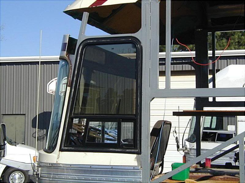 Fitting new model 15 side window during roof raise.