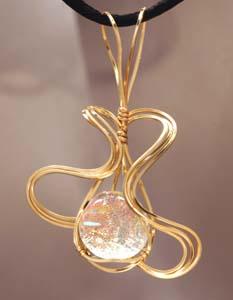 Clear dichroic glass in rolled gold