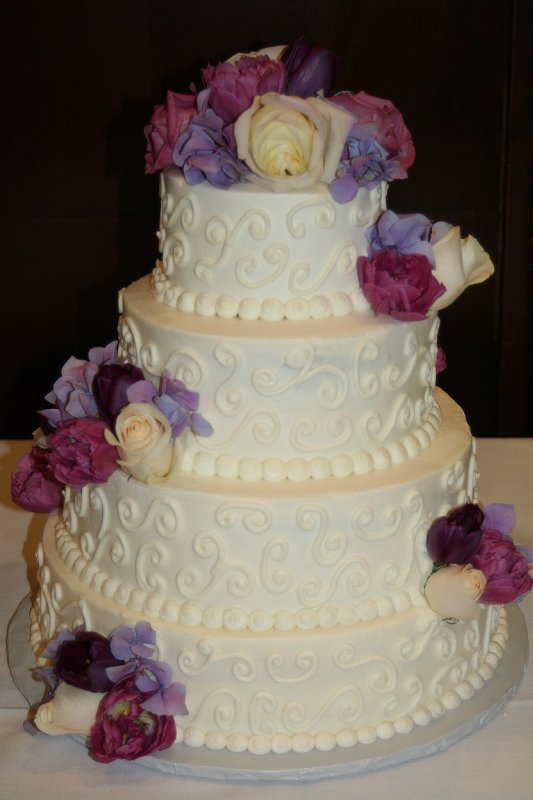 scrolls with fresh flower wedding cake