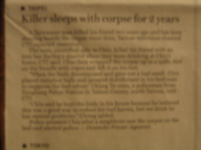 Blurry but says "Killer sleeps with corpse for 2 years"...