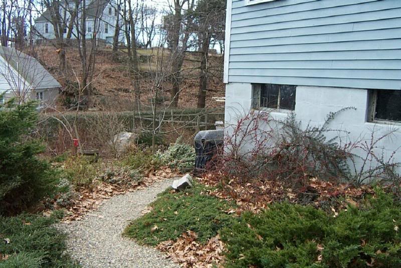 The stone path around to the back of Crow Cottage.