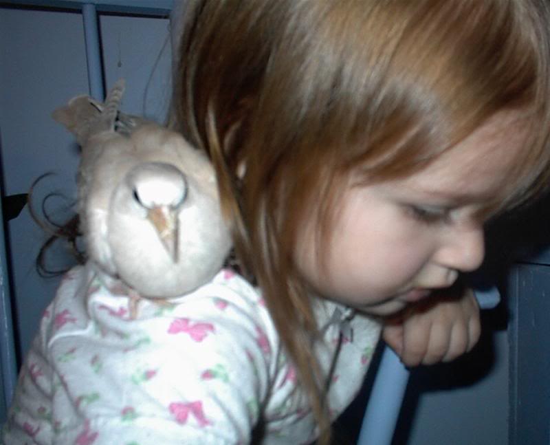 Baby Dove sits on Rebecca's shoulder