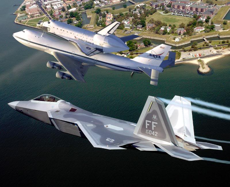 F/A-22 Raptor escorts space shuttle atop a shuttle carr...