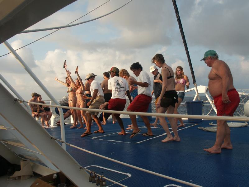 Playful crowd onboard the catamaran shore excursion