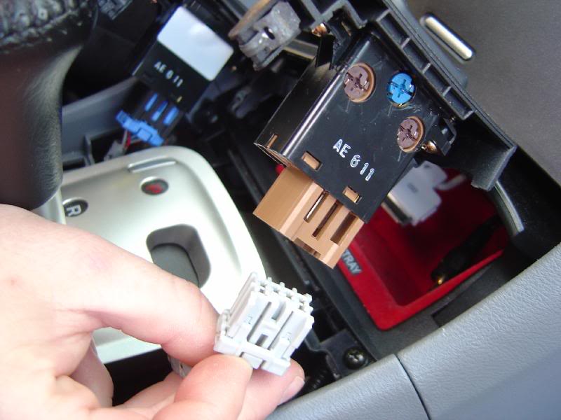 unclip the 2 seat heater plugs by pushing down the plas...