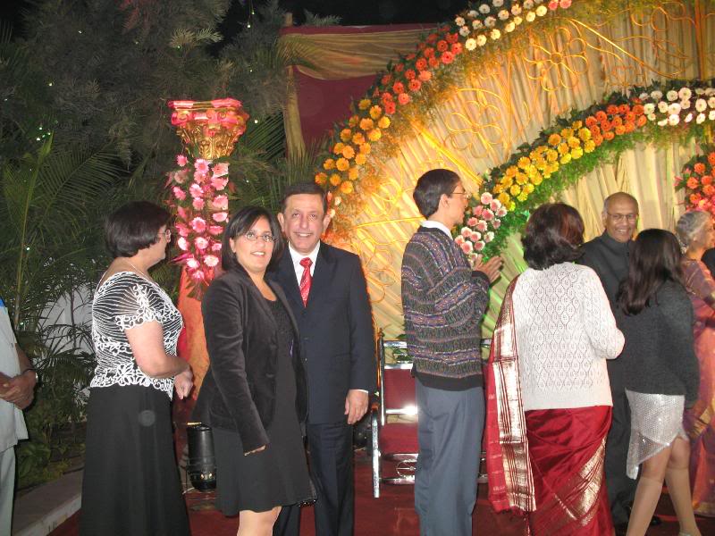 Dad and I waiting in line to congratulate Priya