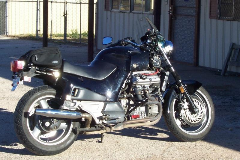 Side View showing Rear bags, mufflers, and 1/2 seat