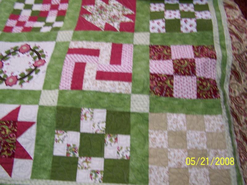 close up of challenge quiilt Srips of fabric was dontat...
