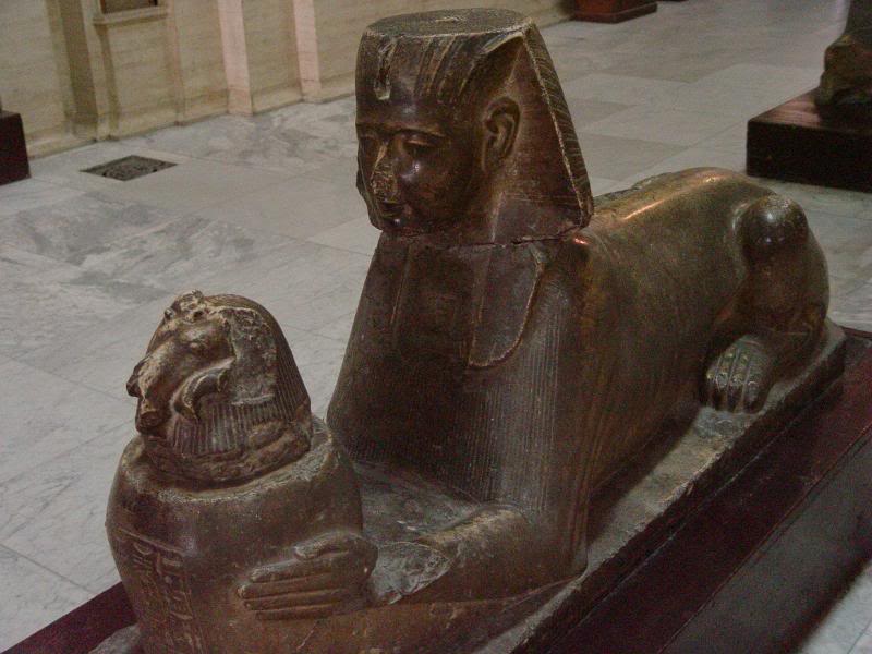 Small sphinx holding a canopic jar