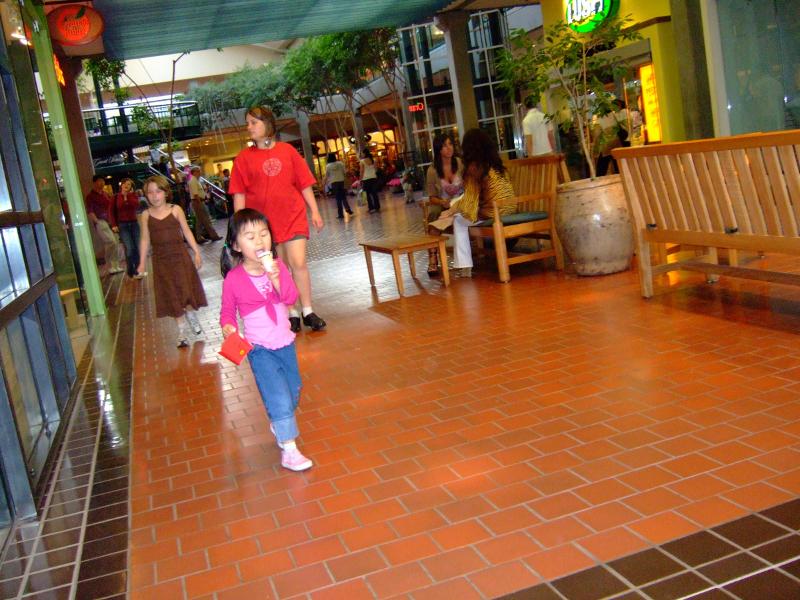 Alyssa is enjoying junk food while shopping in the Bell...