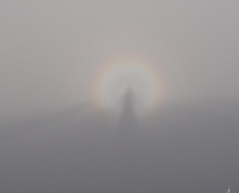 Teri's shadow in a round rainbow - Maui