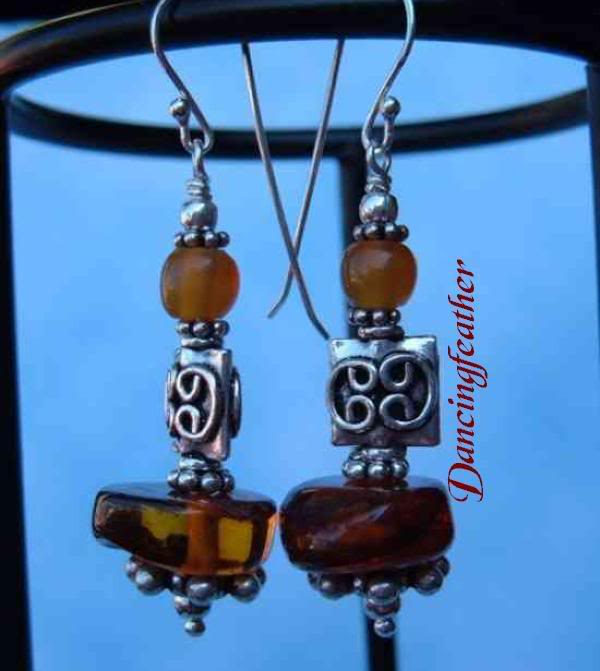 Amber discs and balls, with Bali beads in squares and s...