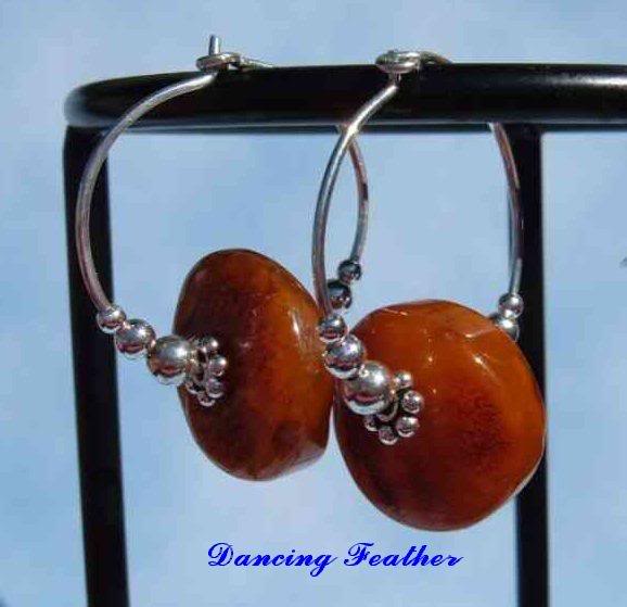 Amber discs on handmade hoops, with graduated sterling ...