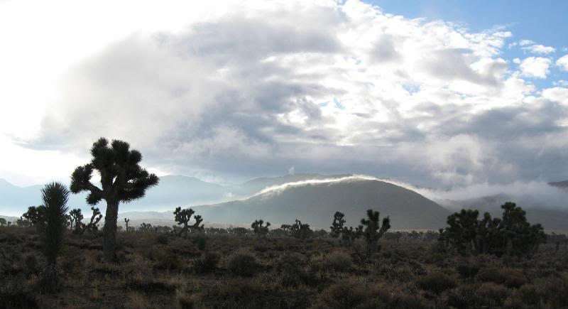 Clouds rolling over the hill