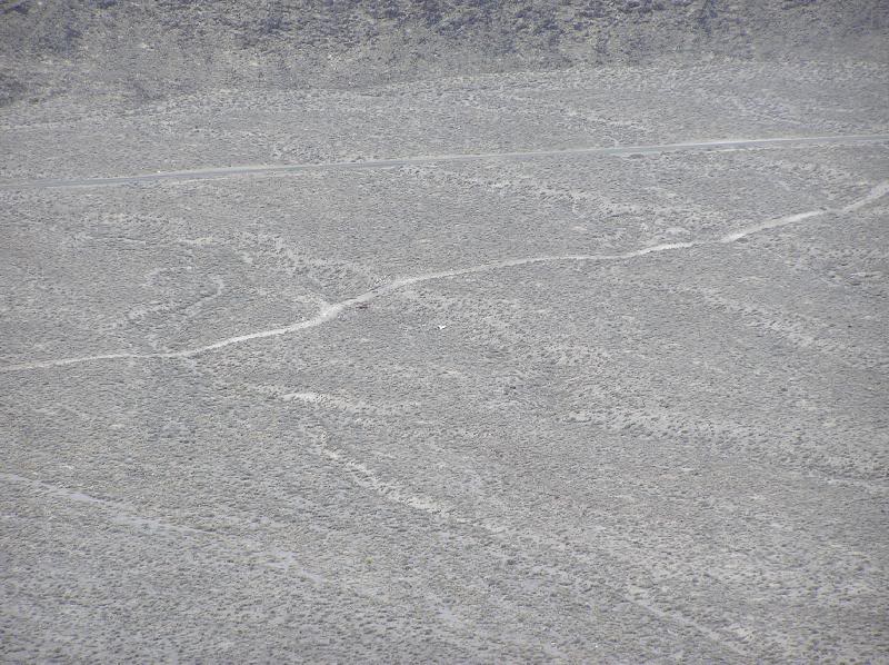 White dot along dirt road is a Cessna wreck