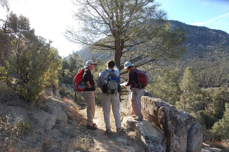 John , Tom and Kathy checking maps