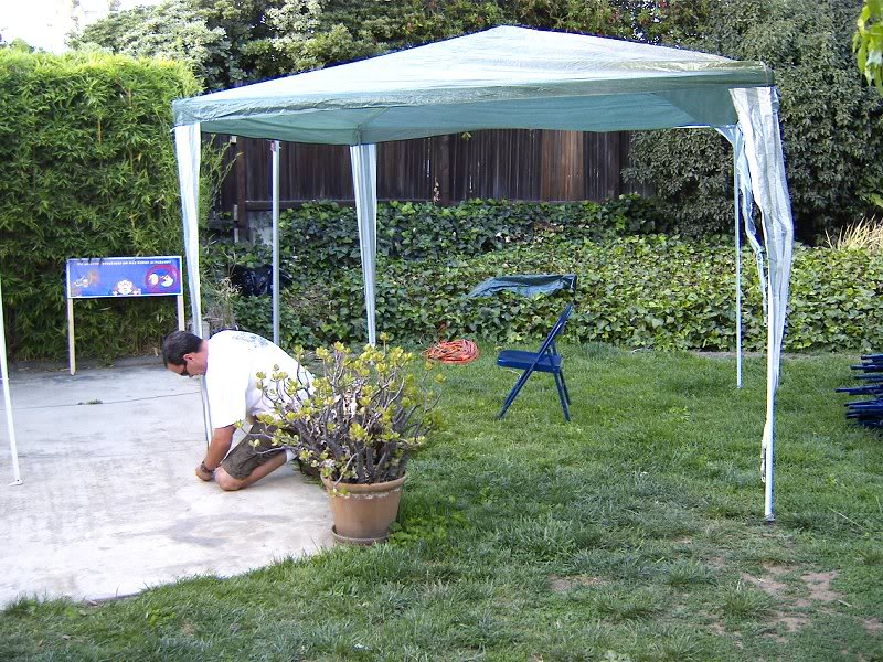 Chris gets the canopies set up for the arcade games