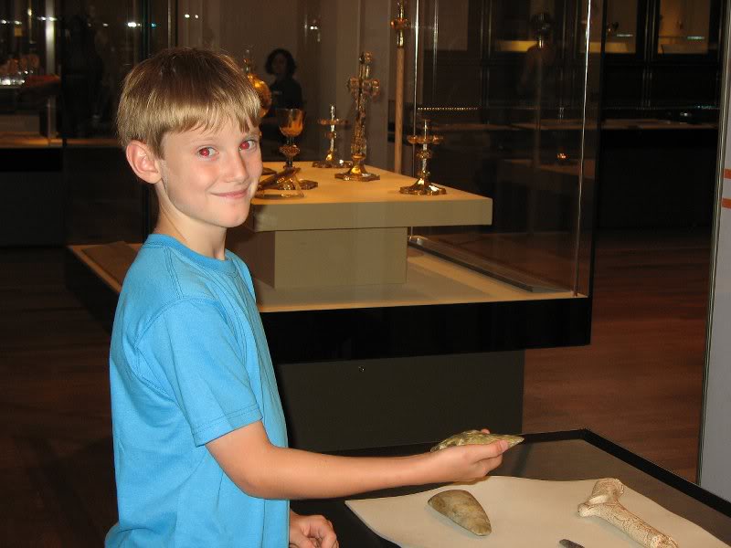Adam holding very old object in the British Museum