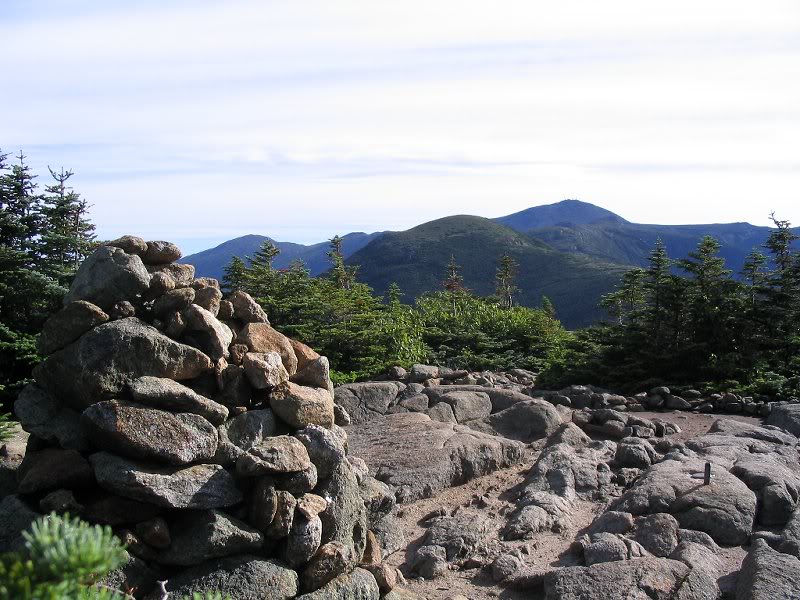 Pierce summit cairn with a view up the ridge
