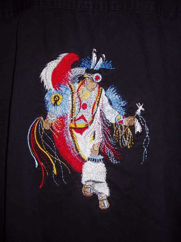 indian on black shirt.