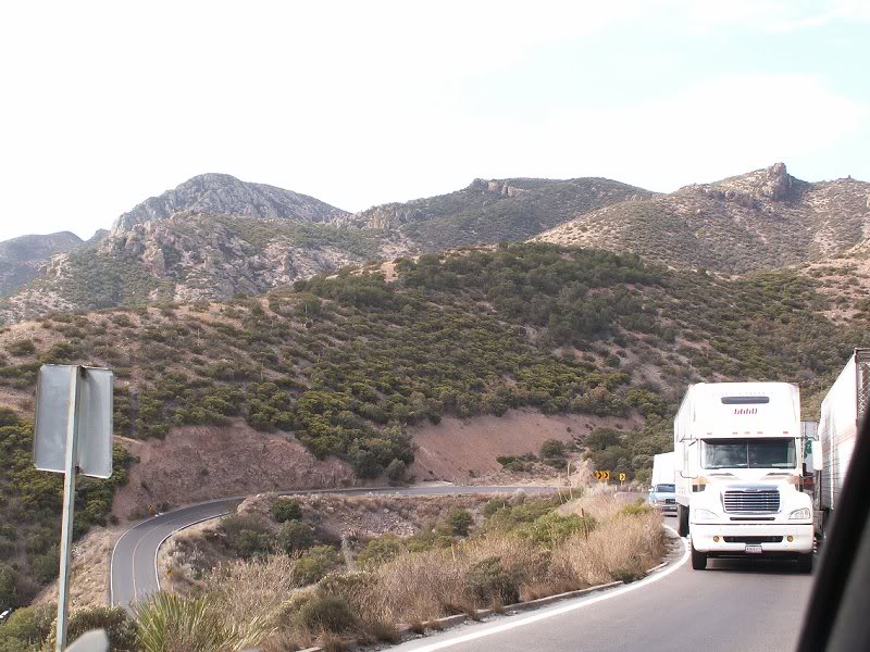 Waiting for a long load truck to clear a hairpin turn