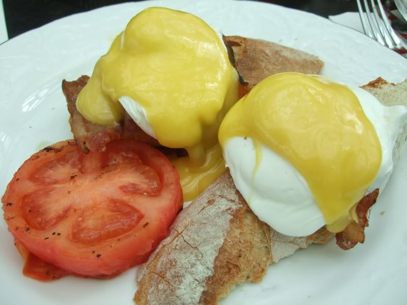 4. eggs benedict - poached eggs and bacon served on far...