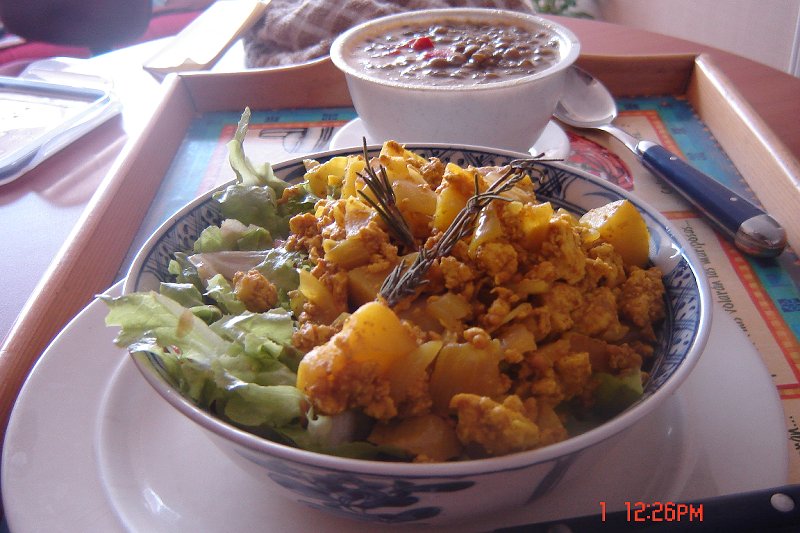 Leftover curried potatoes and scrambled tofu on Lechuga