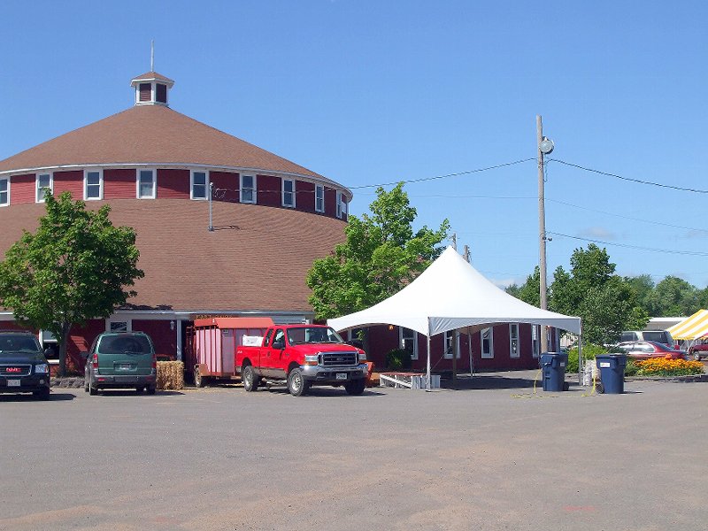 Truck And Trailer Backed Up To The Round Barn By The In...