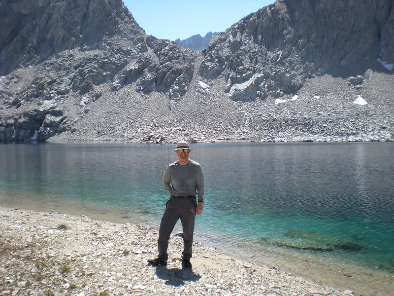 Luc poses at a barren unnamed lake at 11,654 ft.