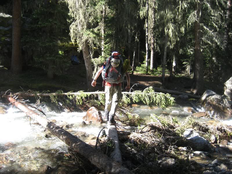 Adam crossing the creek