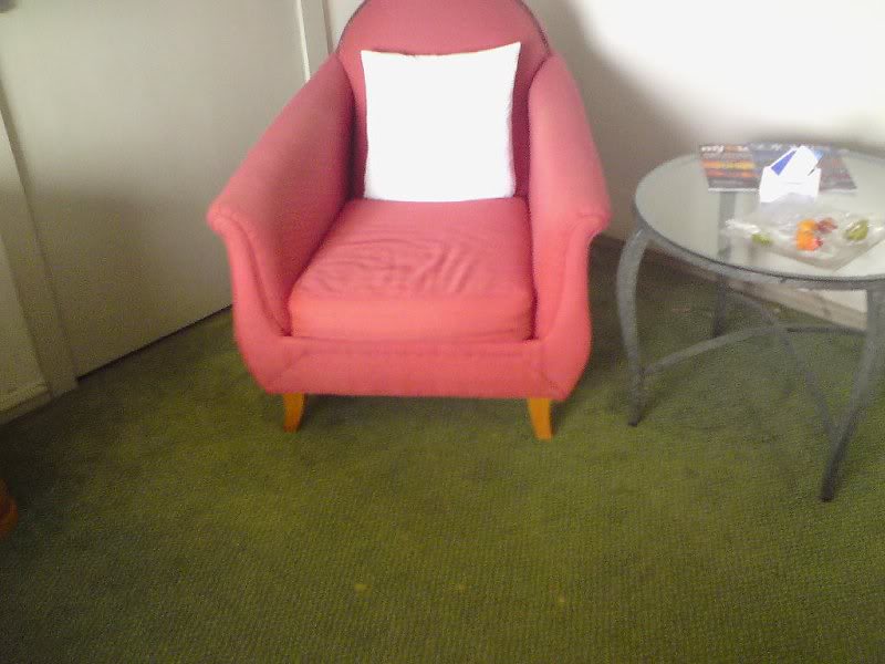 Old chair, old carpe with stainst.