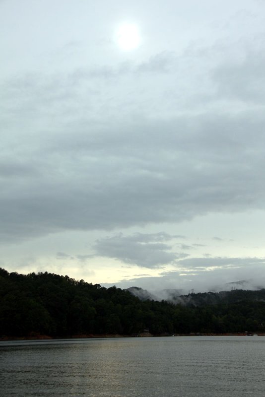The sun peaking through over Lake Jocassee