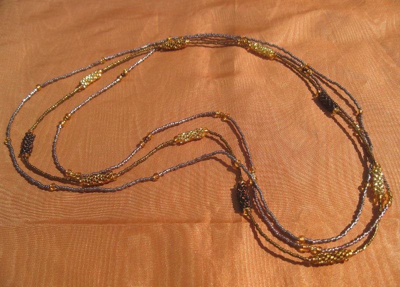 3 Strings of barrel beaded beads