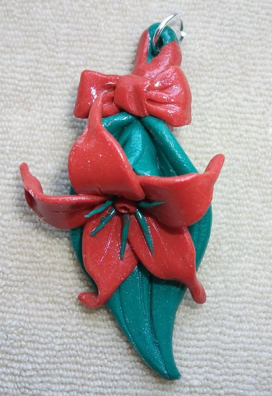 floare - pandantiv - (lungime 5 cm, latime 2 cm) sculpe...