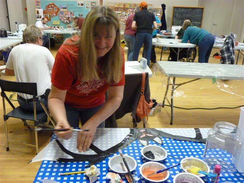 Carol Matthews applies her design