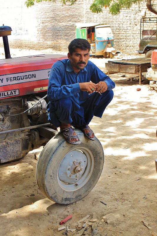 Our driver waiting outside a workshop in Ahmedpur East