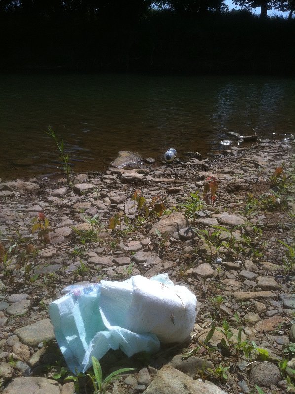 diaper and trash at swimmin hole