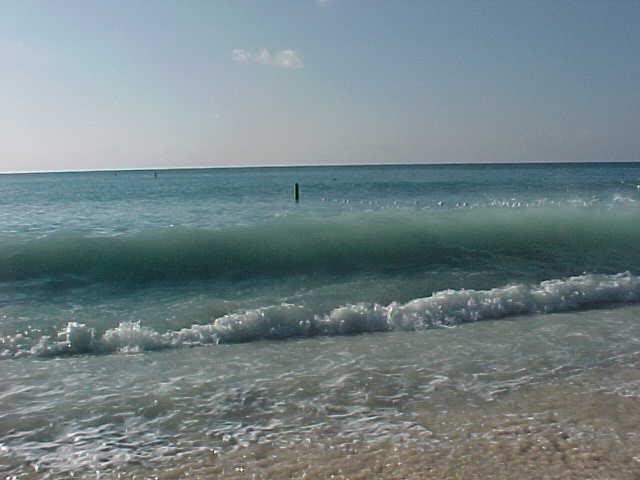 Surf (and, in the water, mooring post)