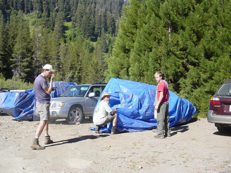 Windwalker wrapping the blue diaper around Josh's car